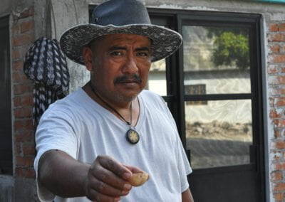 A person holding artisanal mezcal