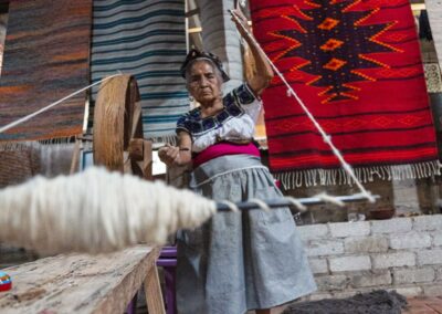 A person making Teotitlan rug