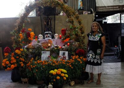 A woman with an altar for Day of the Dead