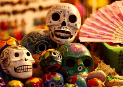 a group of skulls and a fan for Day of the Dead celebration