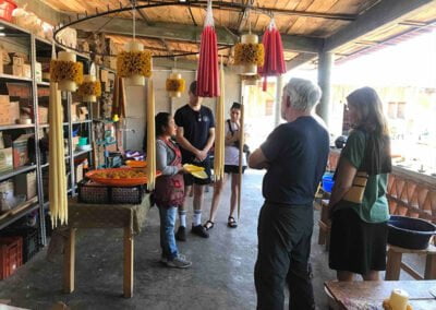 a group of people looking at a presentation of Oaxaca culture