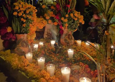 a group of candles and flowers
