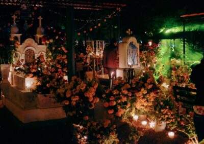 a cemetery with flowers and candles