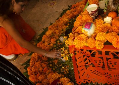 A woman touching the yellow flowers