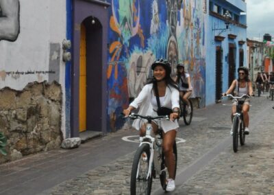 a group of people riding bicycles on a street