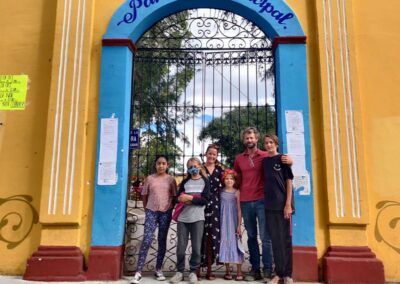 a group of people standing in front of a gate