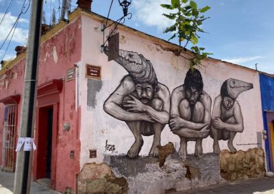 A mural of three people