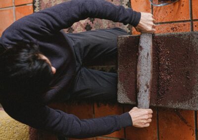 A person from above grinding chocolate beans