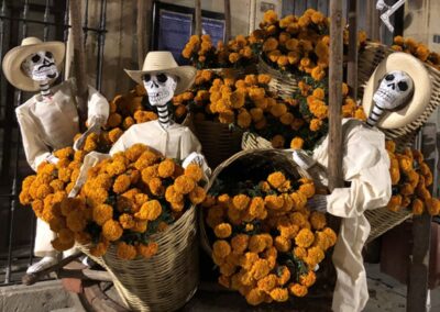 Skulls with buckets of flowers