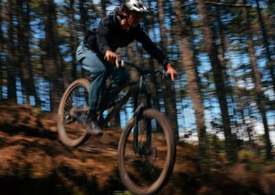 A man doing mountain biking tricks