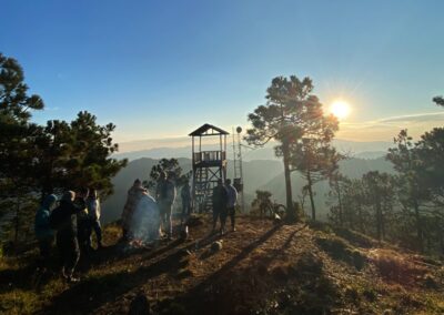 A group of people standing on a hill