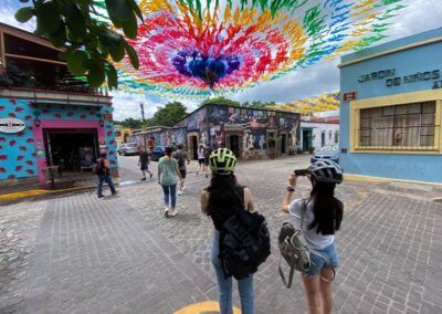 Two women taking a photo while street biking