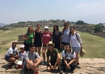 A group of people taking picture in Monte Alban