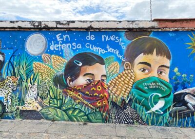 A mural of two people wearing masks