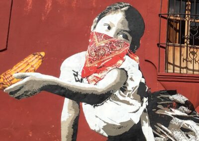 A mural of girl with red mask