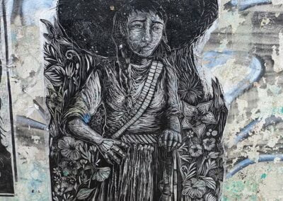 A mural of boy with a hat