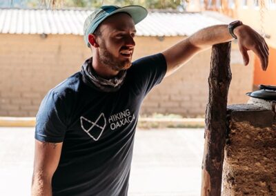 a man leaning on a pole