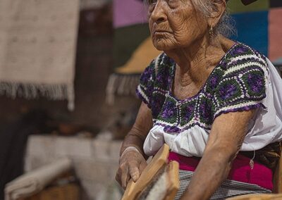 A woman doing textile rug