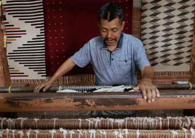 A man doing textile rug