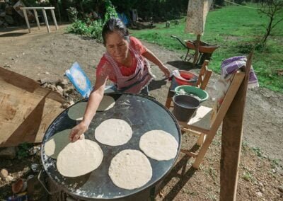 A woman making tortillas
